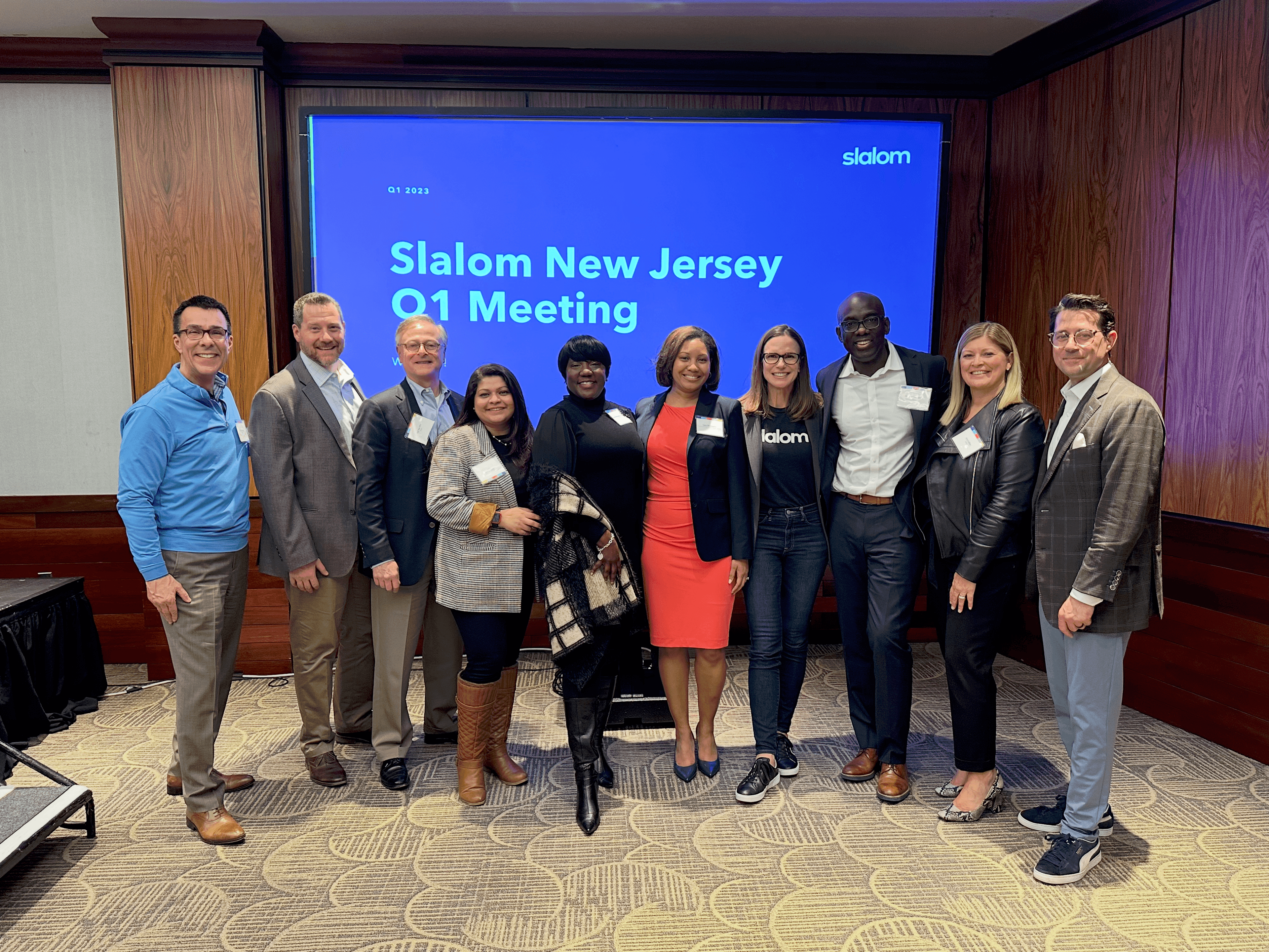 Rashan Thompson with leadership team in business setting